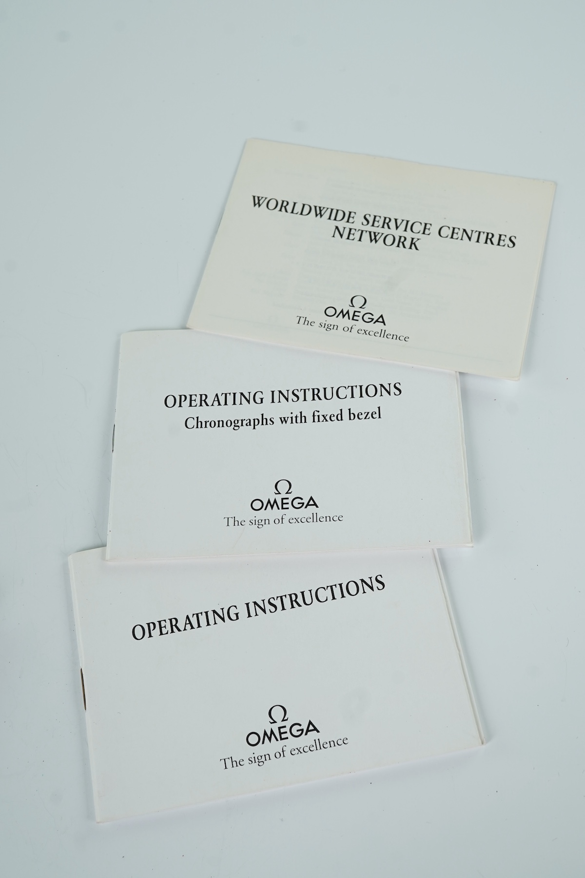 A gentleman's late 1990's stainless steel Omega Speedmaster automatic wrist watch, with box and three pamphlets